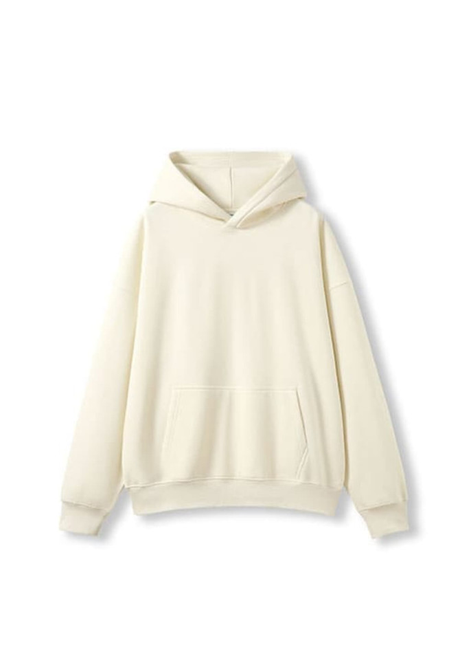 An oversized hoodie in a soft cream colour, featuring a front pocket and a hood. There is a logo on the garment.