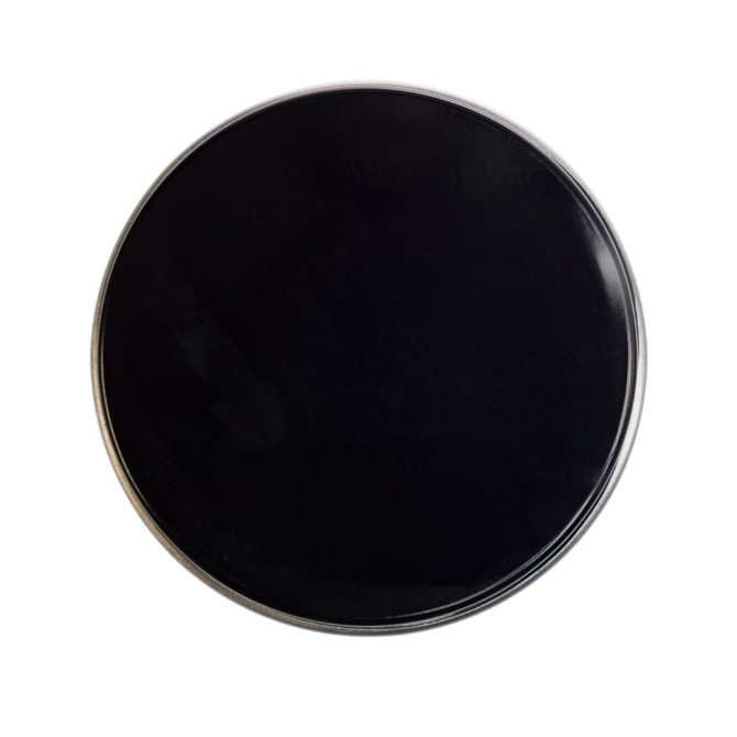 A petite candle in a sleek black tin container, designed for home living and ambiance enhancement.
