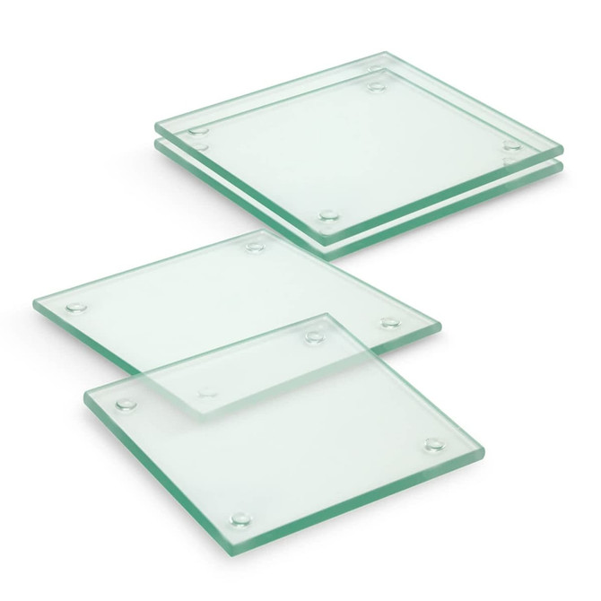 A set of four square glass coasters, featuring a transparent green tint with rounded corners.