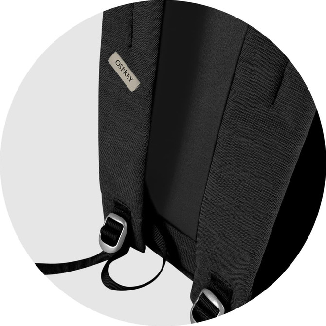 A black fabric backpack featuring adjustable straps and a logo tag on the back.