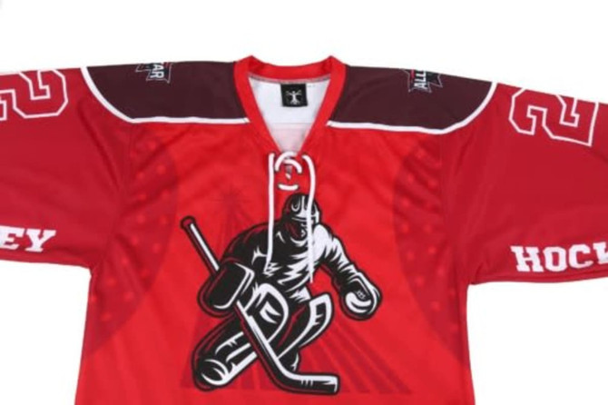 A red hockey jersey featuring a graphic of a player and a logo, with brown accents on the shoulders.
