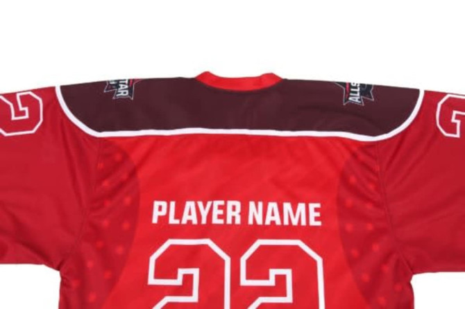 A red hockey jersey with a maroon yoke, featuring a logo and space for a player's name and number.