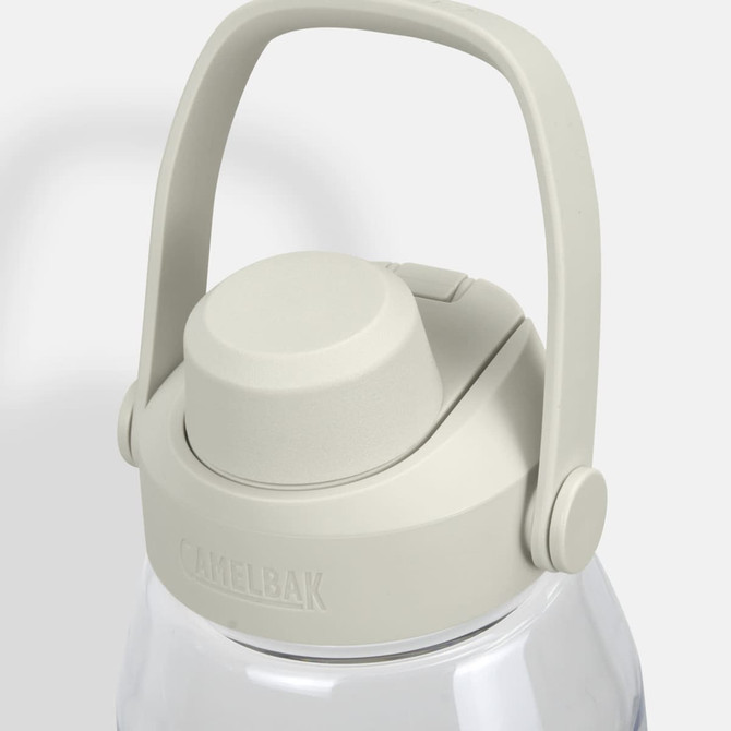 A drink bottle in clear plastic with a light grey lid and handle, featuring a logo on the lid.