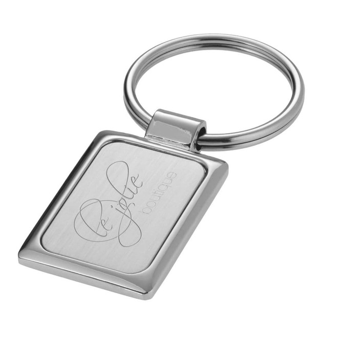 A rectangular silver keyring featuring a polished metal surface and a circular attachment loop.