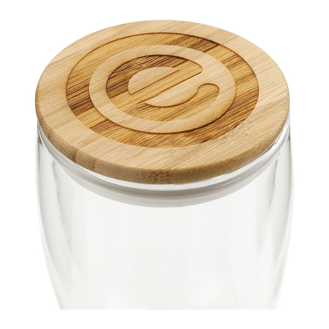 A drink bottle with a clear glass body and a round bamboo lid, featuring a subtle branding element on top.