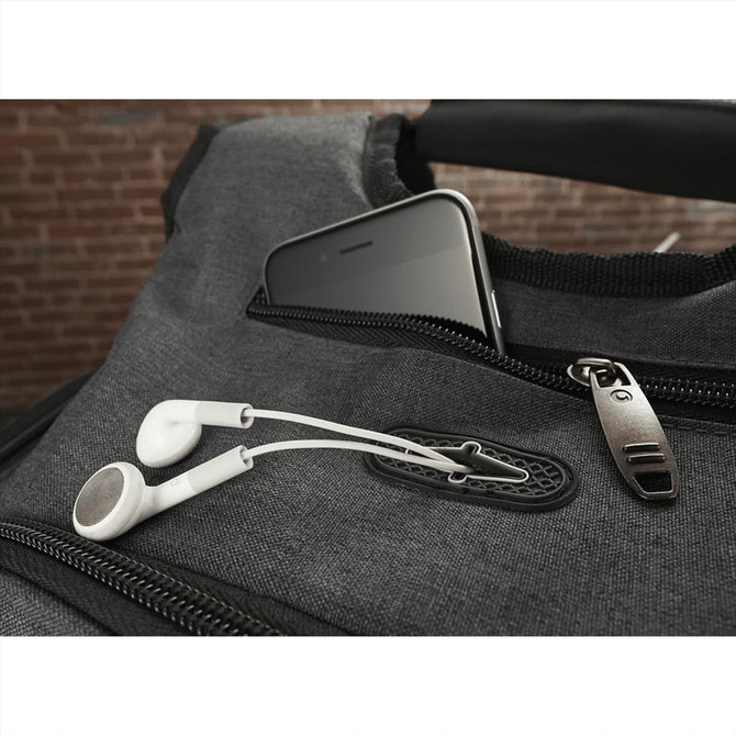 A grey backpack with a smartphone in a pocket, featuring white earphones partially connected.