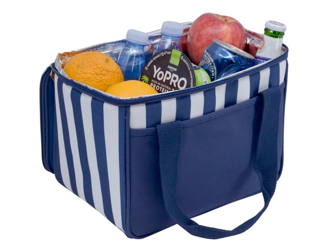 A navy striped cooler bag filled with water bottles, an apple, oranges, and soft drinks, featuring sturdy handles.