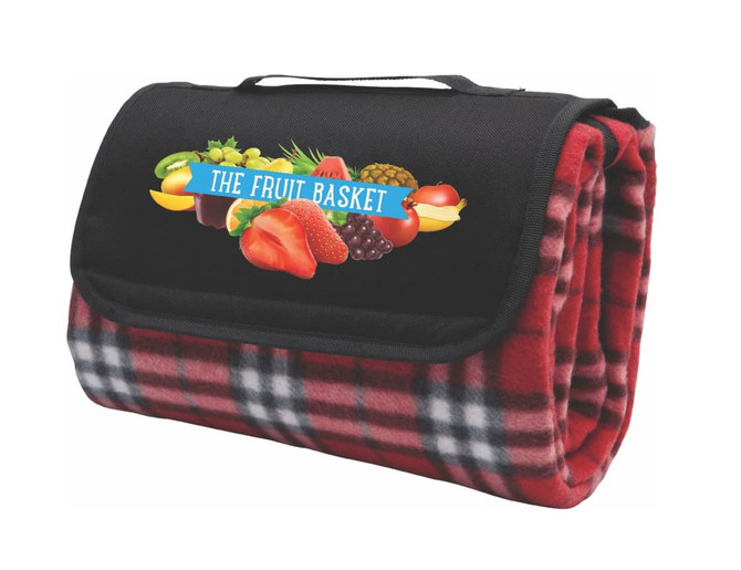 A red check picnic rug with a black flap and a logo of assorted fruits on the front.