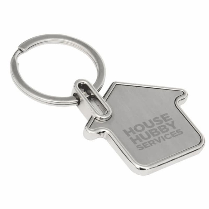 A silver house-shaped keyring with a metal loop and a logo.