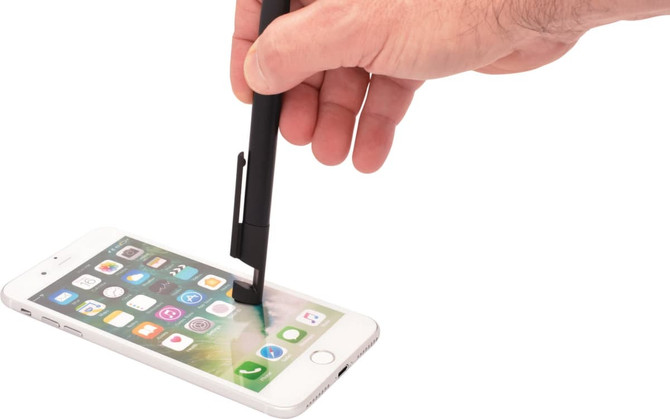 A black 6-in-1 multi pen is being used on a smartphone screen, showcasing its stylus feature.