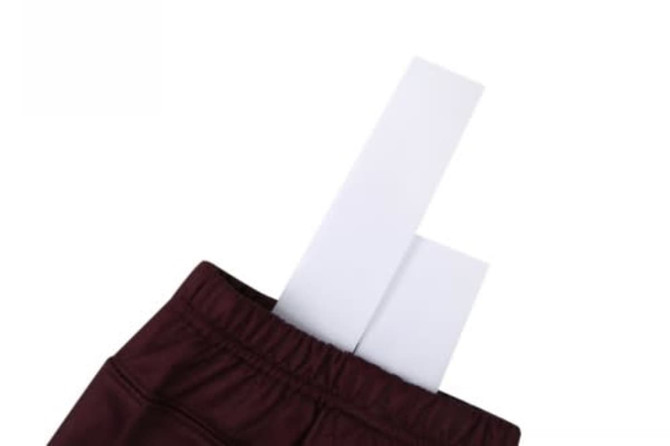 Maroon ice hockey socks with white inserts sticking out from the top. The socks feature a logo.