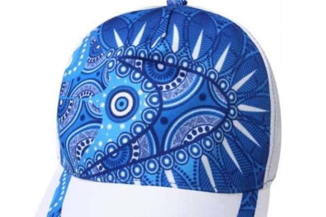 A blue and white sublimated sport cap featuring a decorative geometric pattern and a logo on the side.