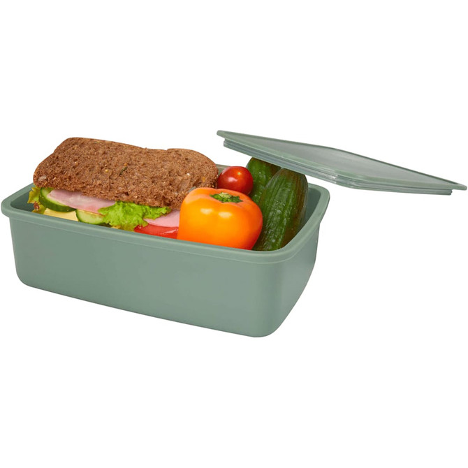 A green lunch box with a sandwich, cucumber, a tomato, and a bell pepper, topped with a lid. It features a logo.
