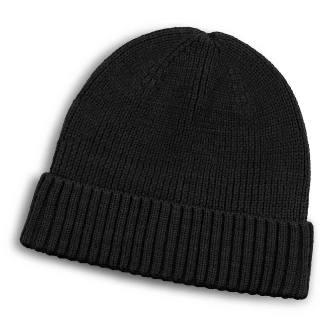 A black Merino wool beanie with a ribbed cuff, laying flat on a white background. It features a logo.