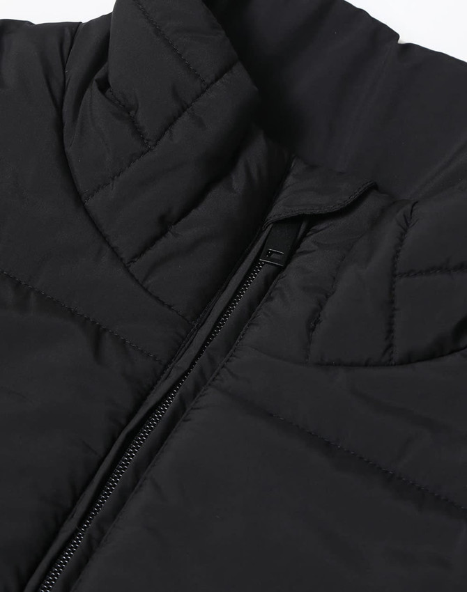A black insulated puffer vest featuring a 3D cut and a zipper, with a branded logo.