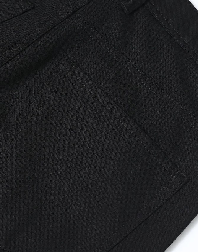 Black flexi chino pants featuring a classic jean style with visible stitching and pockets. Includes a logo.