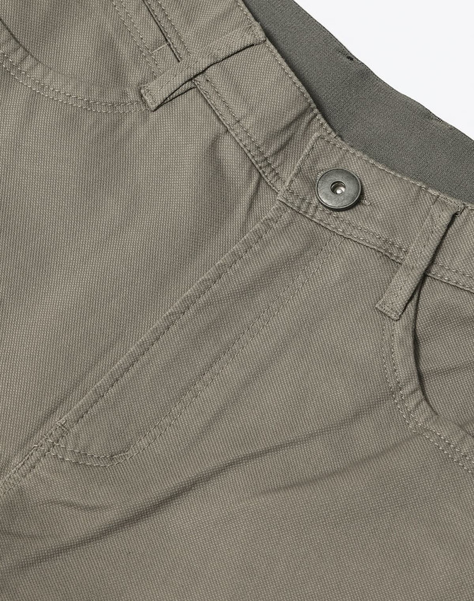 Men's flexi chino pants in khaki with a button closure and subtle pocket details, featuring a logo.