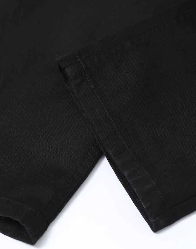Black flexi chino pants with a smooth fabric texture, featuring a cuffed hem and subtle branding.