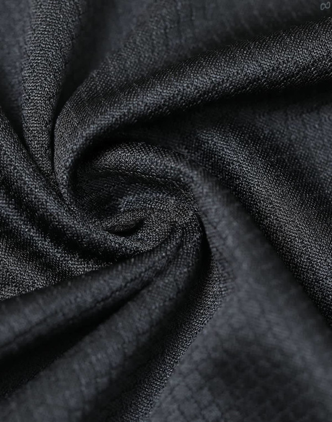 A close-up of black jacquard knit fabric, featuring a textured pattern and a subtle sheen, ideal for polo shirts.