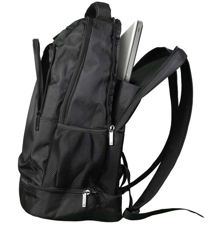 A black backpack featuring multiple zippered compartments and mesh pockets, with a laptop partially visible inside.