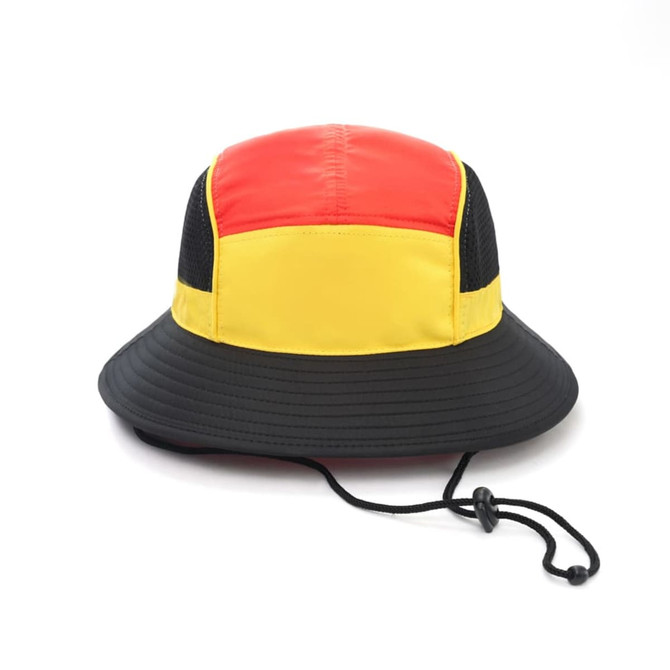 A panelled bucket hat in red, yellow, and black with a chin rope and a logo.