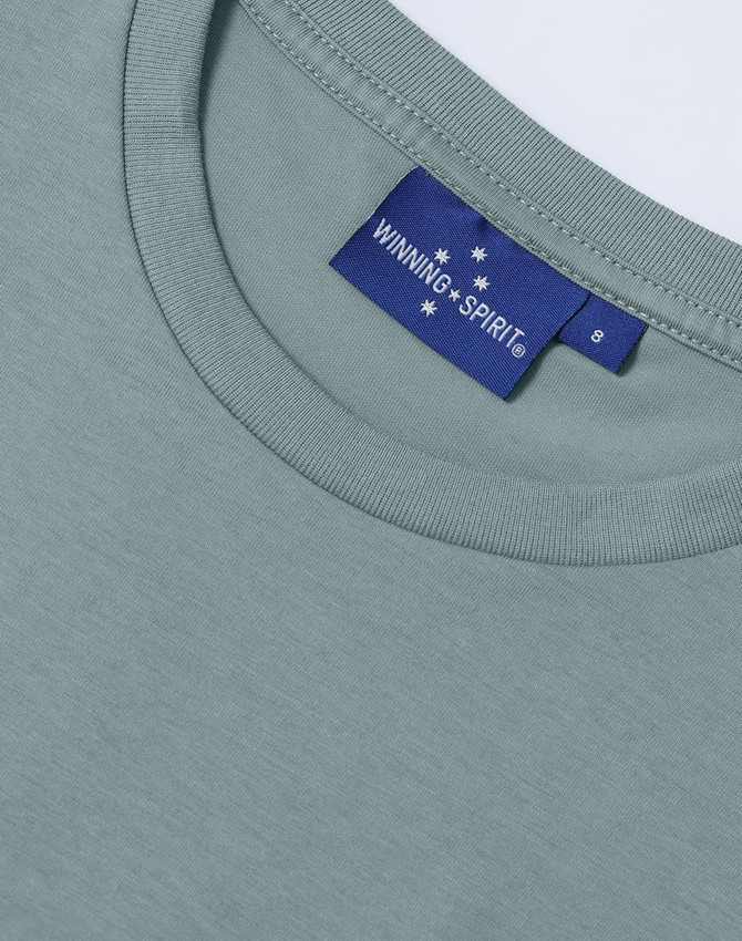 A light green ladies' premium cotton short-sleeve tee shirt featuring a label with a logo.
