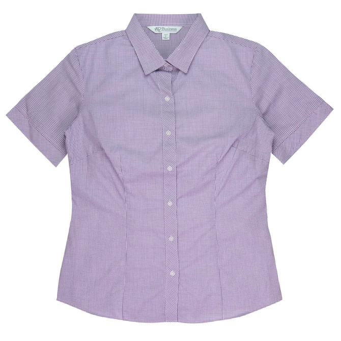 A short sleeve, button-up shirt in a purple and white check pattern, featuring a collar and a logo.
