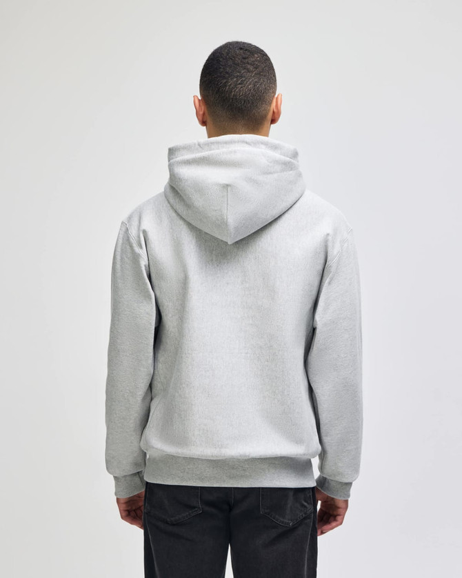A grey hooded sweatshirt featuring a kangaroo pocket and a logo on the back.