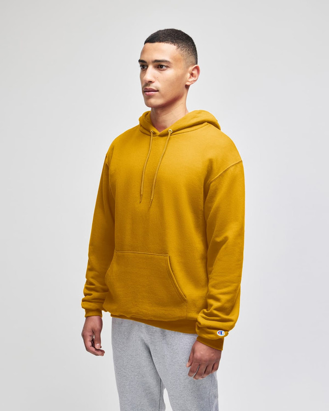 A hooded sweatshirt in a vibrant mustard yellow, featuring a front pocket and a logo.