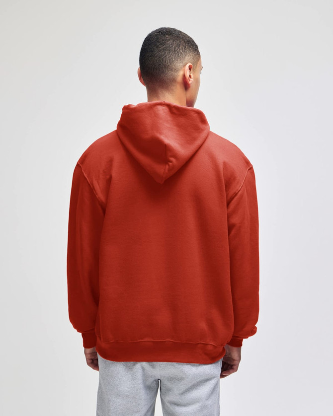 A red pullover hooded sweatshirt with a large hood, seen from the back. Features a logo on the garment.