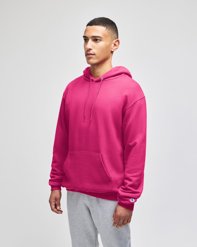 A pink pullover hooded sweatshirt with a front pocket and a logo on the sleeve.