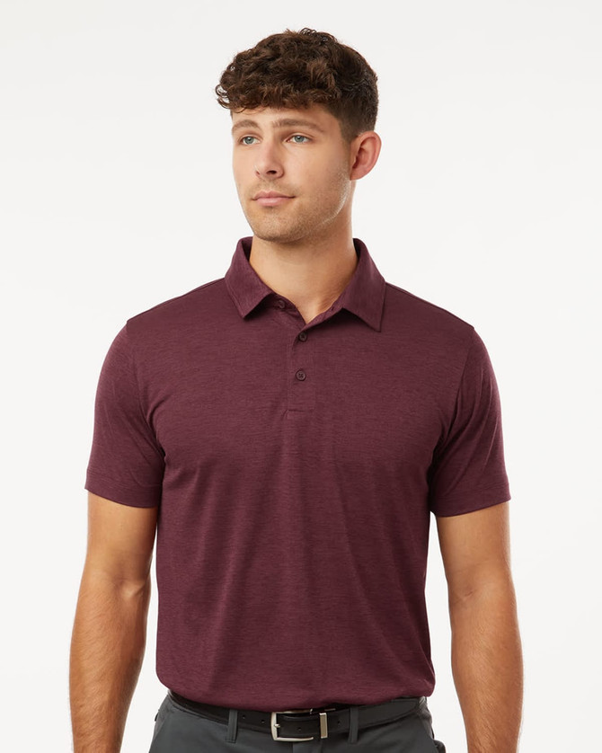 A men's polo in heather maroon with a classic collar and short sleeves. It features a logo on the chest.