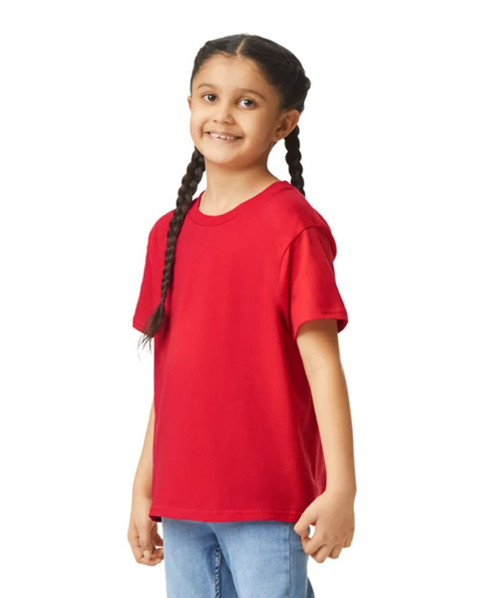 A red youth short sleeve T-shirt is displayed on a smiling child with braided hair. The shirt has a logo.
