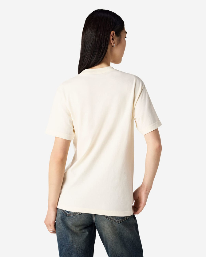 A cream heavyweight cotton unisex T-shirt displayed on a model, featuring short sleeves and a plain back.