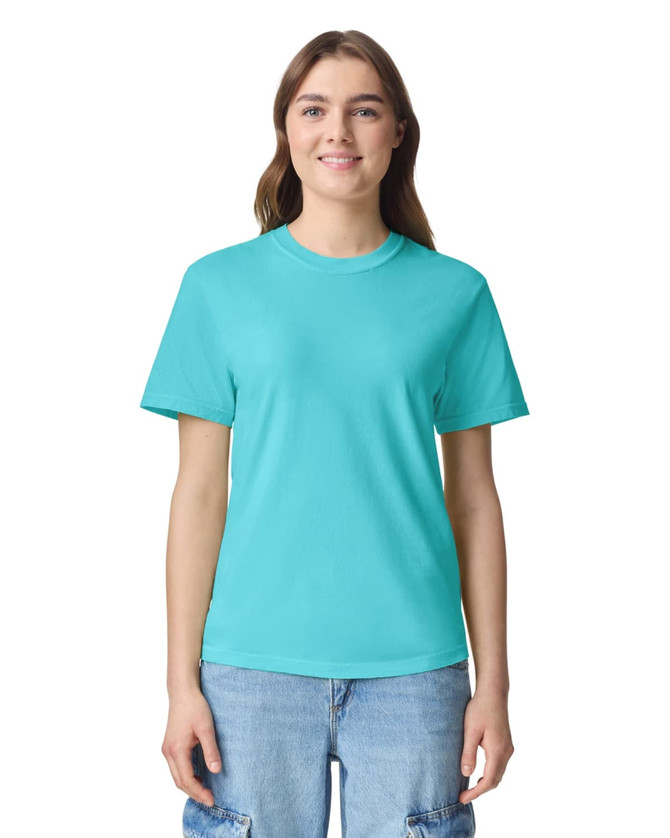 A turquoise adult heavyweight t-shirt displayed on a model, featuring a logo.