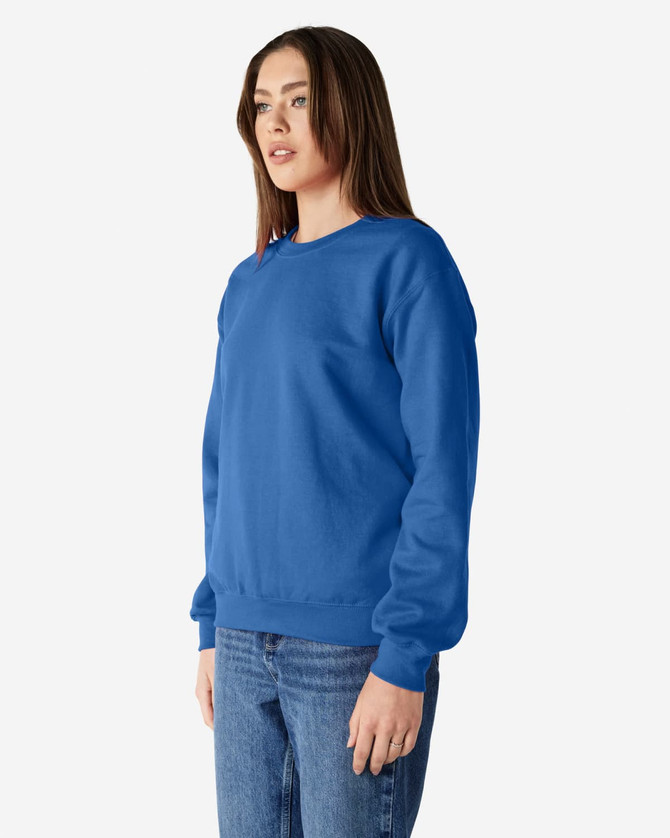 A blue Gildan Heavy Blend adult crewneck sweatshirt displayed on a model, featuring a casual fit and long sleeves.