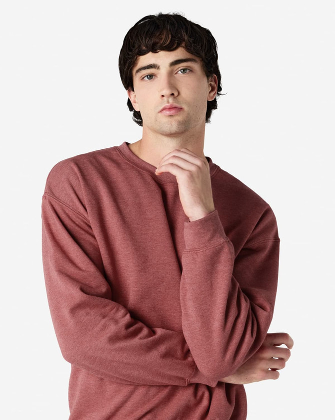 A maroon Gildan Heavy Blend adult crewneck sweatshirt displayed on a model with a neutral background.