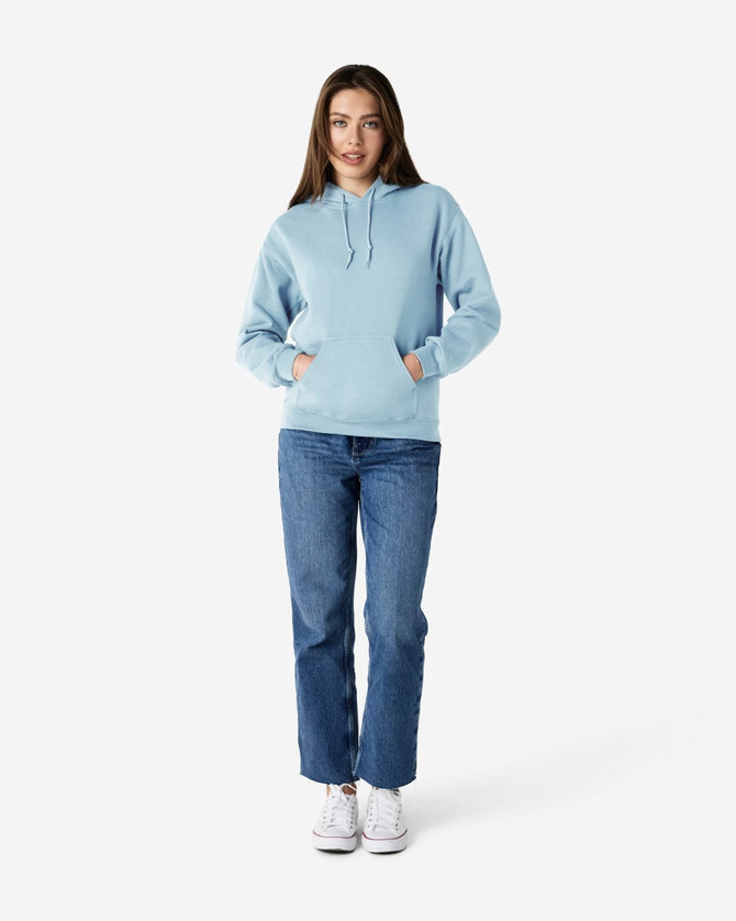 A light blue Gildan Heavy Blend adult hooded sweatshirt paired with denim jeans and white sneakers.