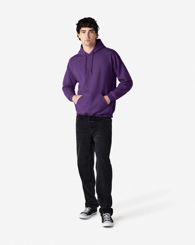A purple hooded sweatshirt with a front pocket, worn by a model. The model is paired with black jeans and sneakers.