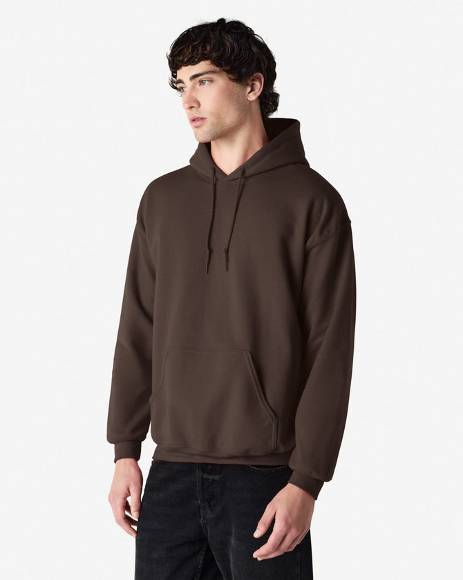 A brown hooded sweatshirt with a kangaroo pocket and a logo. The model is standing against a plain white background.