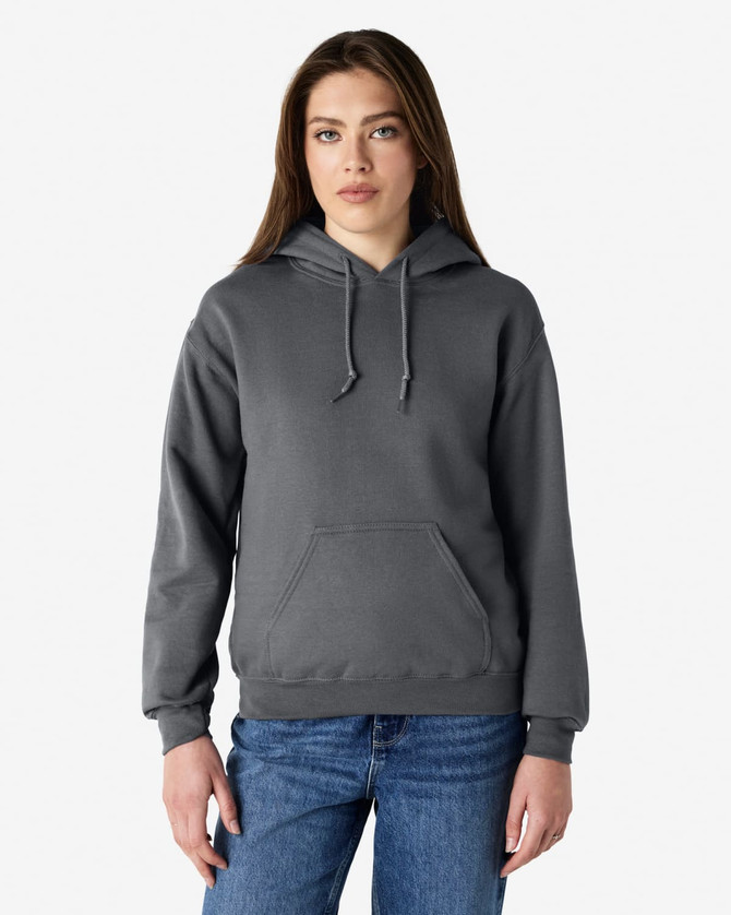 A grey Gildan Heavy Blend adult hooded sweatshirt displayed on a model, featuring a front pocket and a hood.