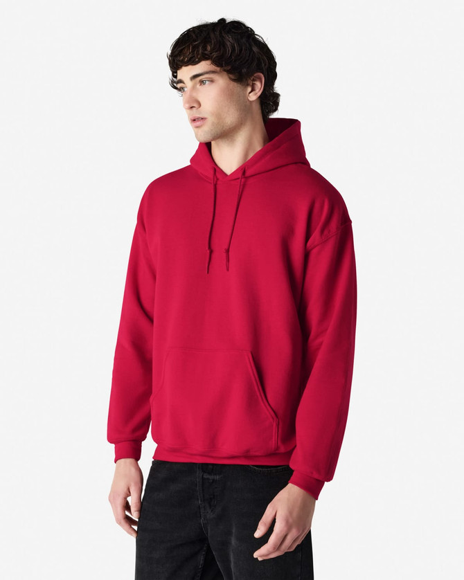 A red hooded sweatshirt with a front pocket and a logo, featuring a relaxed fit and drawstring hood.