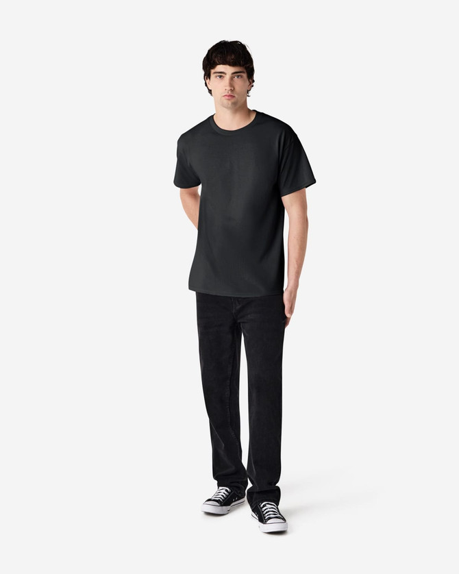 A black Gildan Ultra Cotton adult t-shirt displayed on a mannequin, paired with black pants and sneakers.