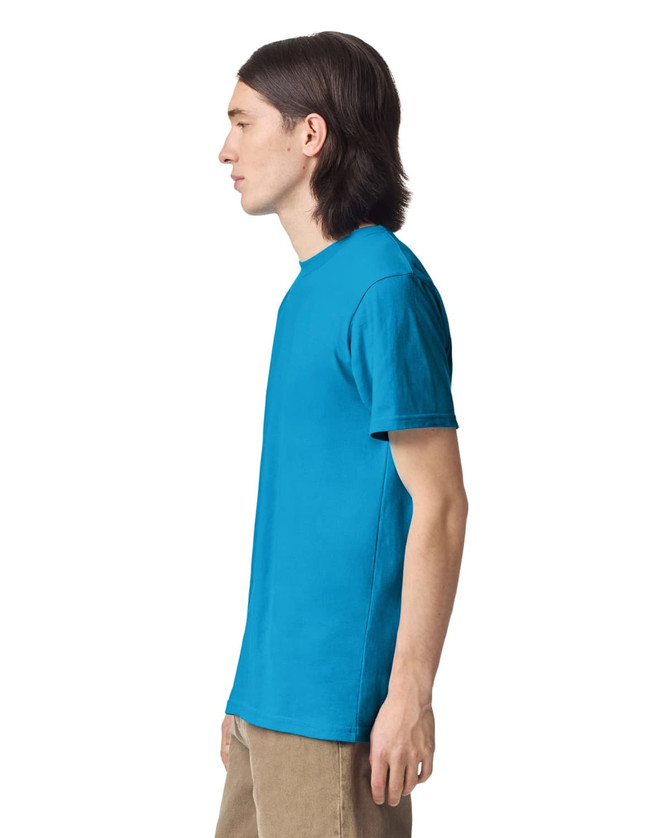 A unisex fine jersey short sleeve t-shirt in bright blue, displayed on a model from the side. It features a logo.
