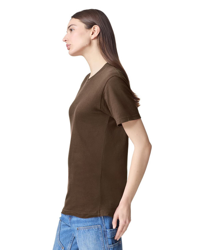 A brown unisex fine jersey short sleeve T-shirt displayed on a model from the side. Features a logo.