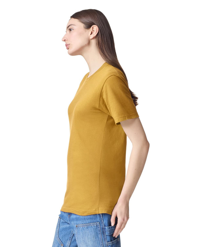 A unisex short sleeve T-shirt in mustard yellow, featuring a simple design and a logo.