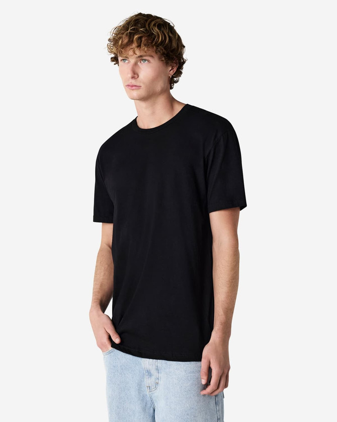 A black unisex CVC short sleeve t-shirt displayed on a model, featuring a simple design and a logo.
