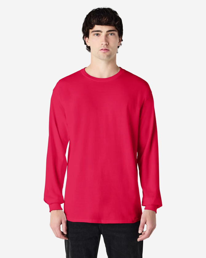 A red long sleeve T-shirt on a model standing against a plain background. The shirt features a logo.