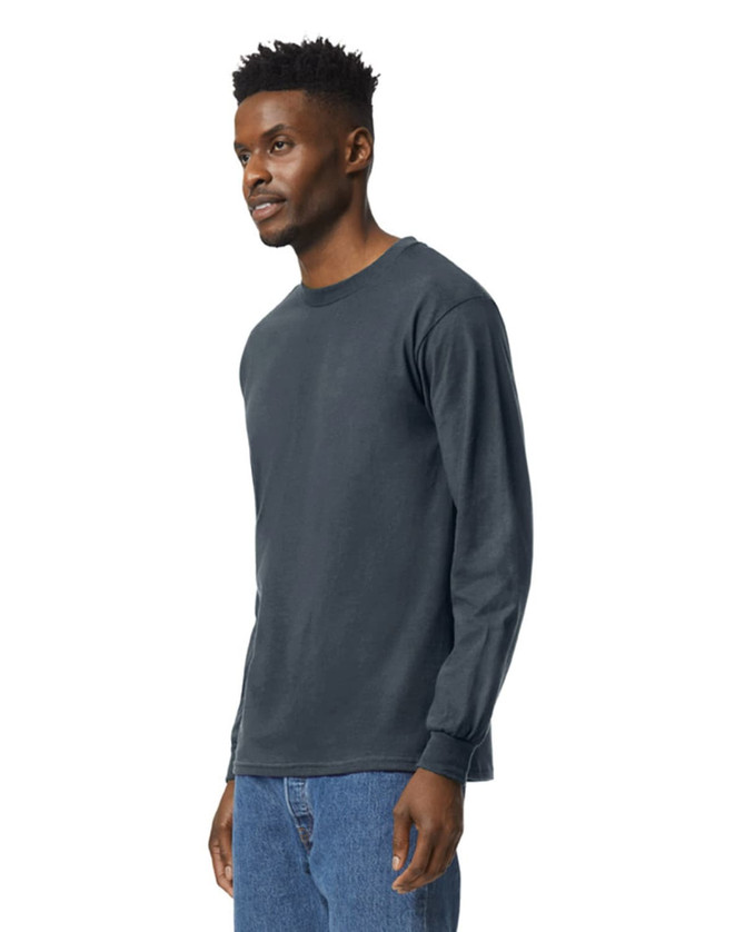 A dark navy long sleeve t-shirt is displayed on a model, featuring a logo on the sleeve.