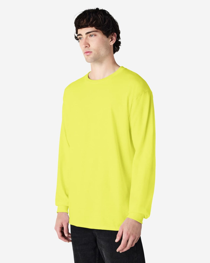 A bright yellow long sleeve T-shirt displayed on a model. The shirt features a logo or branding.